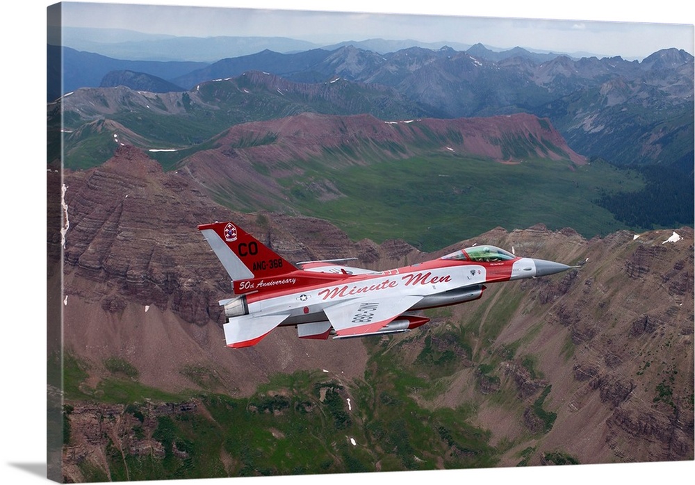 Minute Men paint scheme on an F-16 Fighting Falcon over Rocky Mountains.