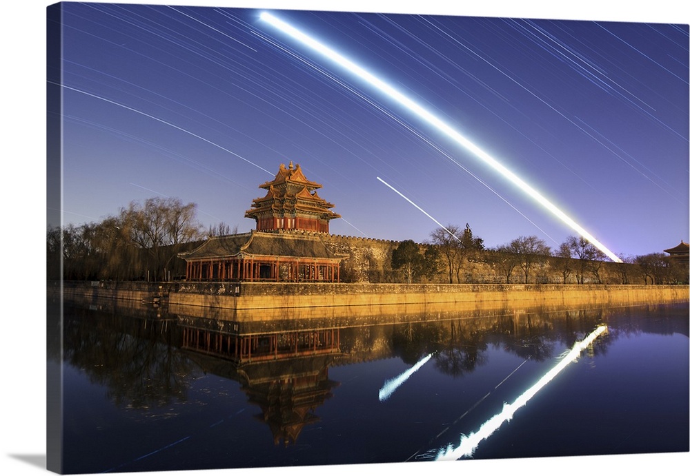 Moon, Mars, Venus and stars trail above the Jiaolou tower in Beijing, China.