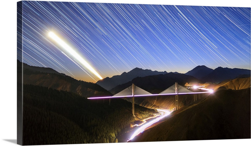 Moon, star and car light trails as they set above the Guozigou Bridge in Xinjiang, Northwest China.