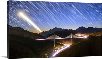 Moon, Star And Car Light Trails As They Set Above The Guozigou Bridge In Xinjiang, China