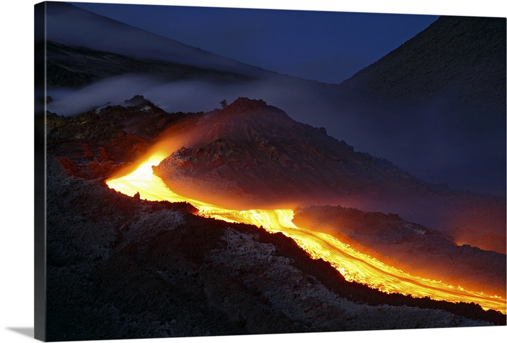 Mount Etna lava flow at night Sicily Italy