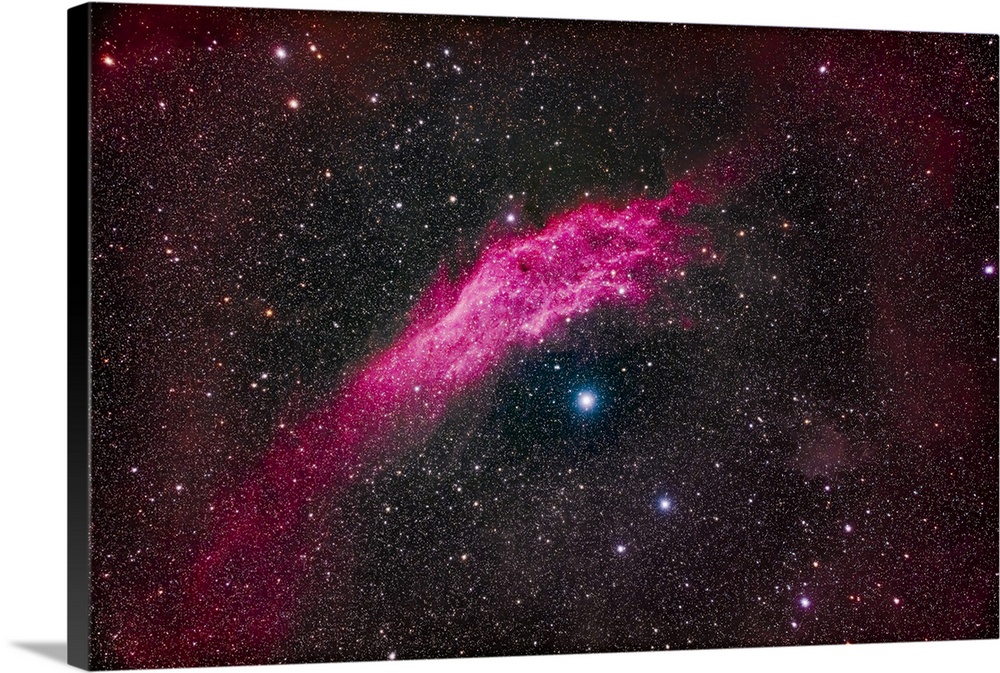 NGC 1499, the California Nebula, in Perseus. This visually faint emission nebula shines above the hot blue star Zeta Perse...