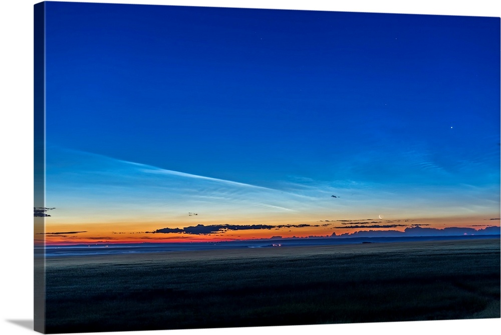 Noctilucent clouds at dawn with the moon and Venus.