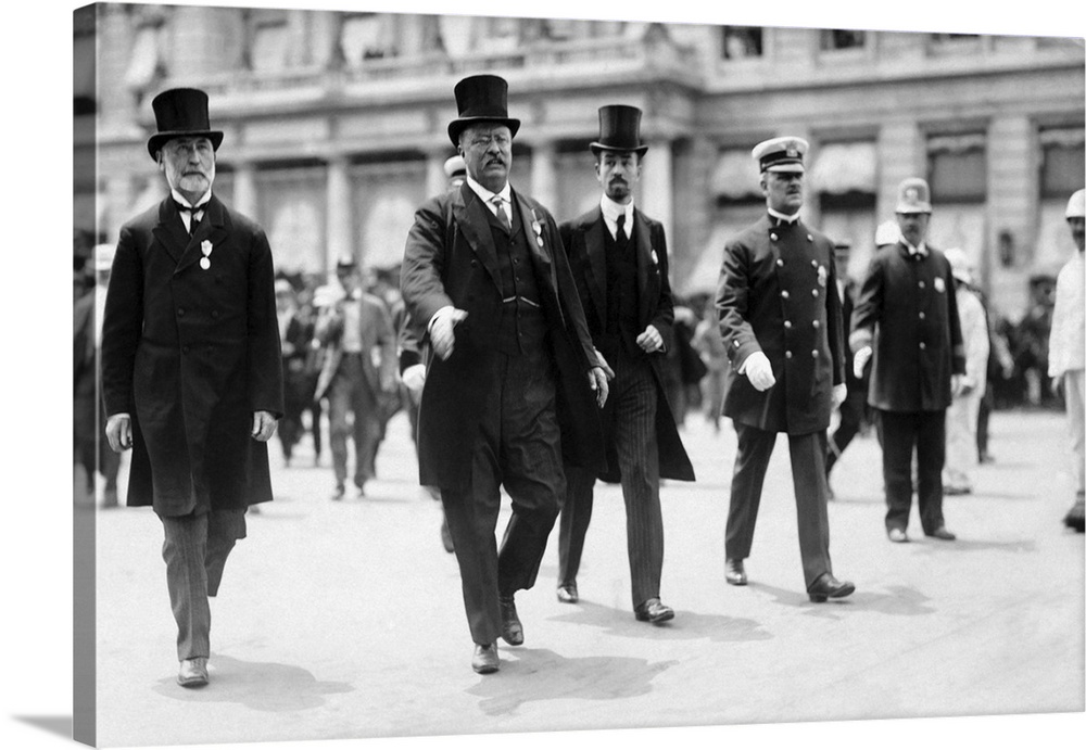 NYC Mayor William Gaynor and Cornelius Vanderbilt walking with Theodore Roosevelt during a parade.