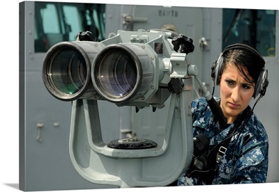 Operations Specialist looks out from the port bridge wing aboard USS Blue Ridge