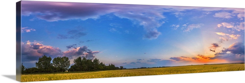 August 6, 2014 - The colors of the sunset sky in a 360 degree panorama at sunset in Alberta, Canada. The setting Sun is at...