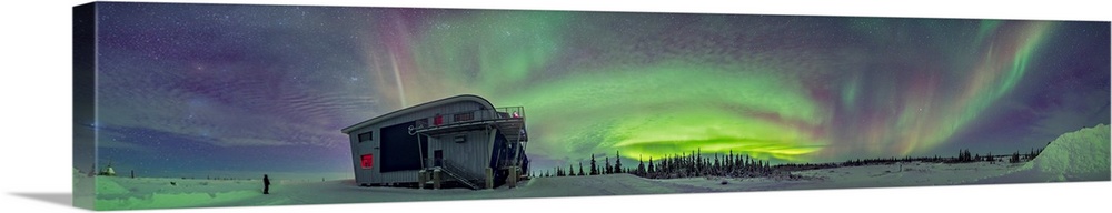 Panorama of auroral arcs on the shore of Hudson Bay, Canada.