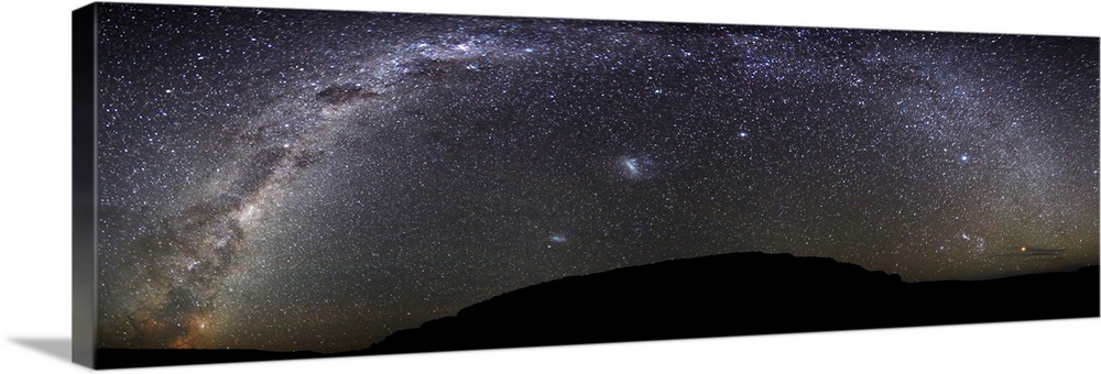 The Milky Way in a panoramic photograph from Scorpius to Orion at the Somuncura Plateau in Argentina. The Magellanic Cloud...