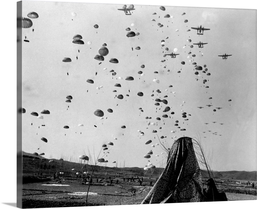 Paratroopers jump from from C-119's over Korea, 1951.