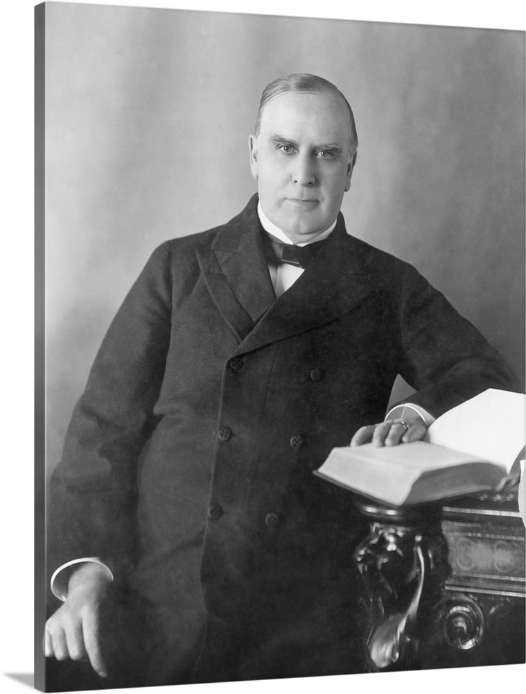 President William McKinley seated at desk, circa 1900.