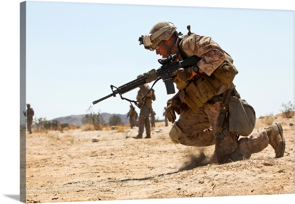 Rifleman kneels to the ground while conducting buddy rushes.