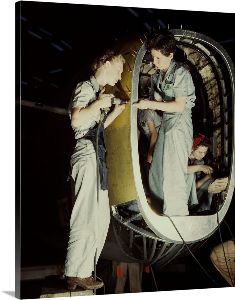 October 1942 - Riveters working on fuselage of a Liberator Bomber at the Consolidated Aircraft Corporation plant in Fort W...