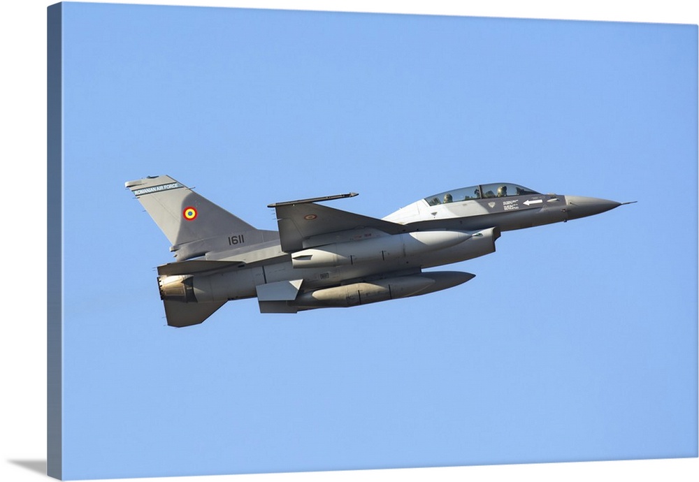 Romanian Air Force F-16B Block 20 MLU takes off from Aviano Air Base, Italy, after a fuel stop during the delivery flight.