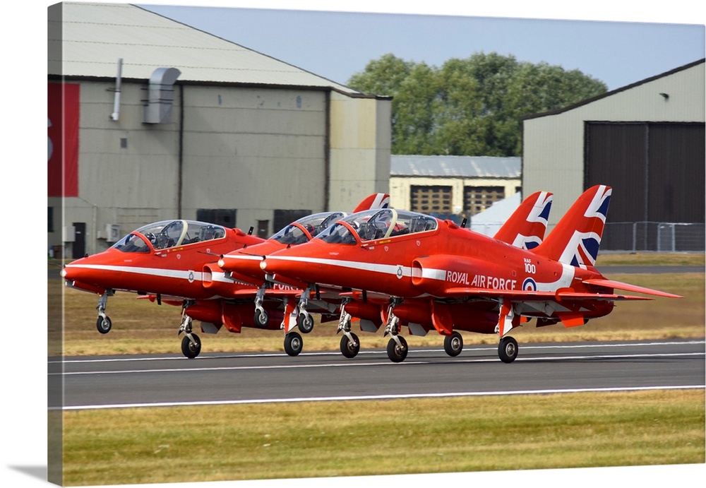 Royal Air Force Red Arrows aerobatic team taking off.