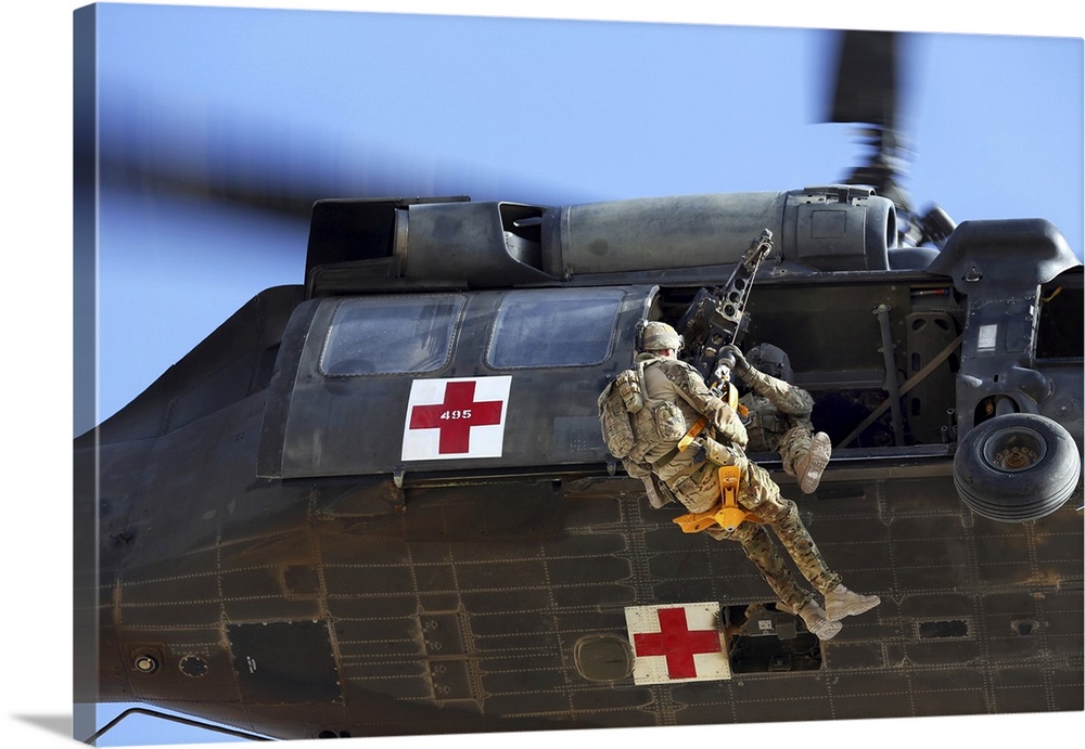 October 13, 2013 - Royal Australian Air Force Aircraftman is hoisted on a jungle penetrator by a United States Army UH-60 ...
