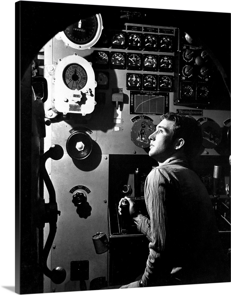 Sailor at work in the electric engine control room of USS Batfish, 1945.