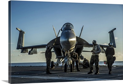 Sailors Perform Post-Flight Procedures On An F/A-18E Super Hornet