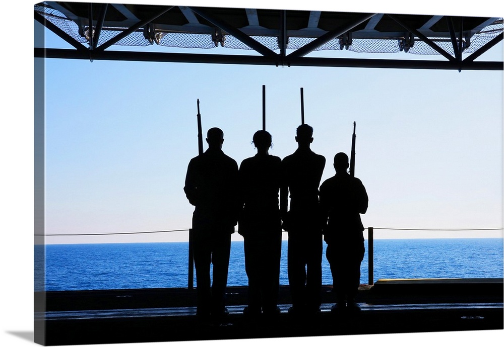 Sailors practice color guard drills aboard USS Kearsarge.