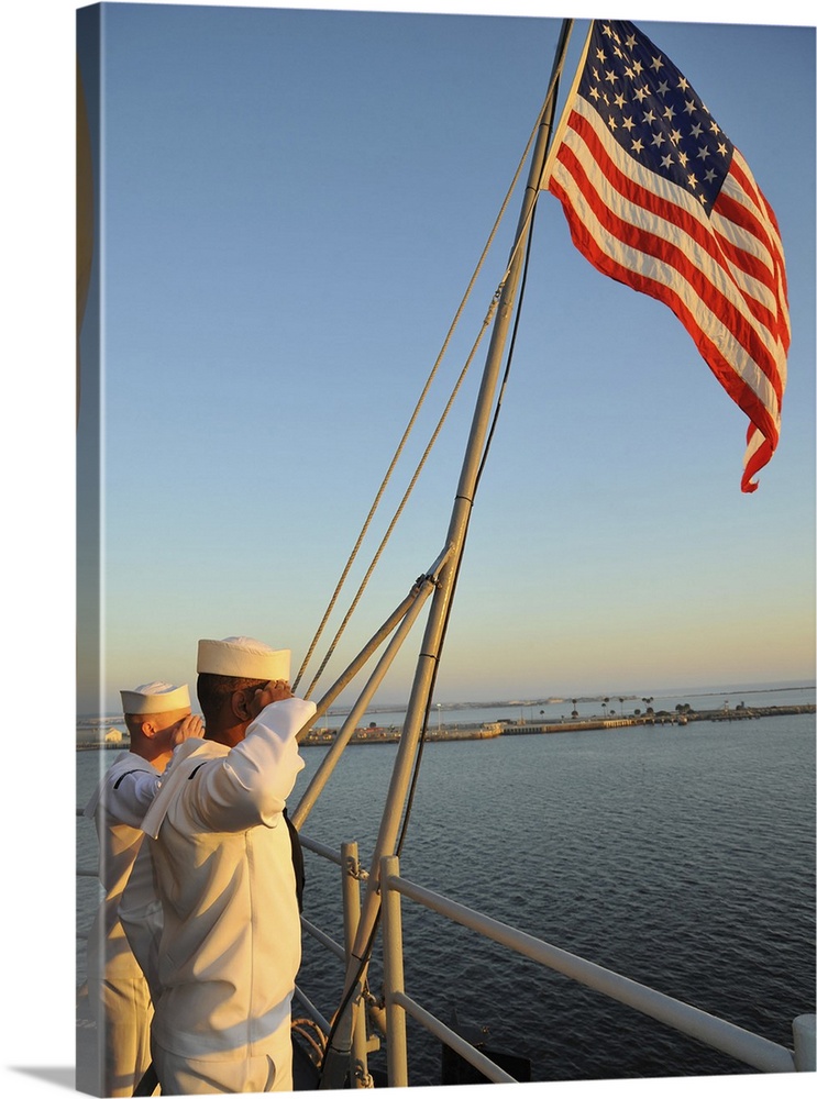Naval Station Mayport, Florida, November 3, 2012 - Sailors salute the national ensign during colors aboard the multipurpos...