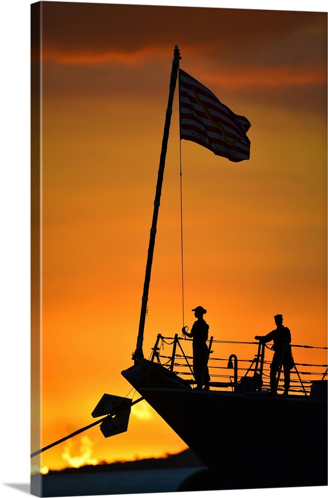 Sailors stand-by for evening colors on USS Hopper.