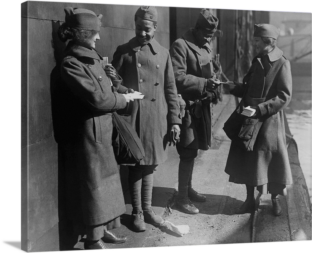 Salvation Army lassies giving sweets to African American soldiers, 1919.