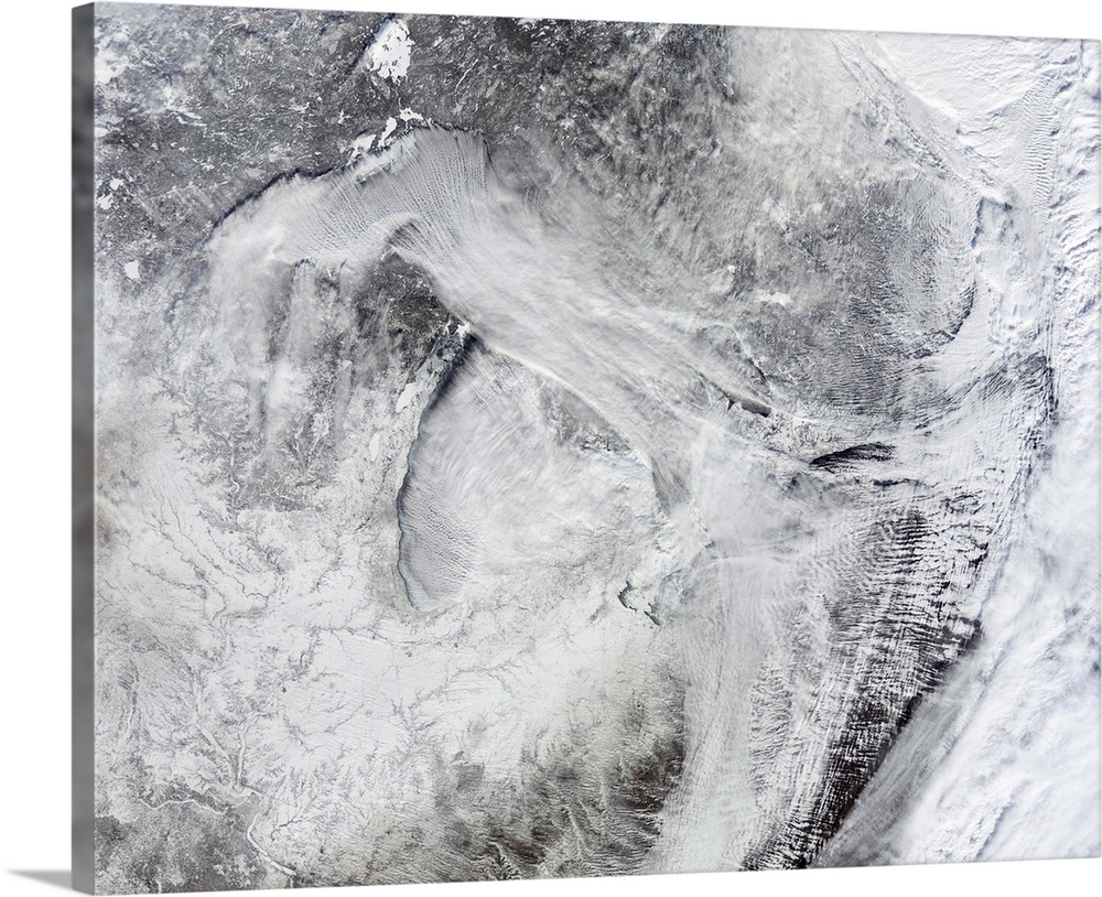 January 6, 2014 - Satellite view of fog forming over the Great Lakes and streaming southeast with the wind. A swirling mas...