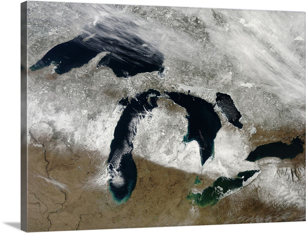 March 28, 2011 - The bright white remnants of snow cut a clean swath across Wisconsin and Michigan during springtime snowm...