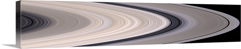 Long panoramic image of the rings of Saturn in concentric circles.