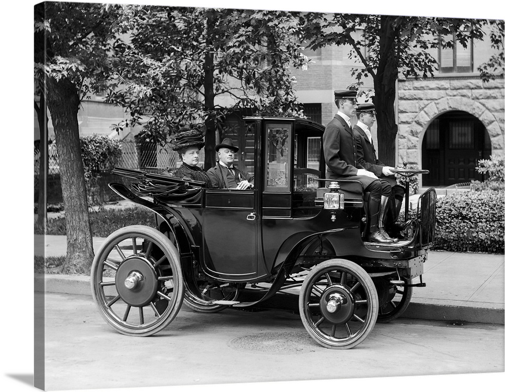 Senator George Wetmore and his wife on board a vintage car in 1906.