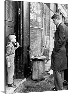 Senator Robert Kennedy Discussing School With A Young Child In New York