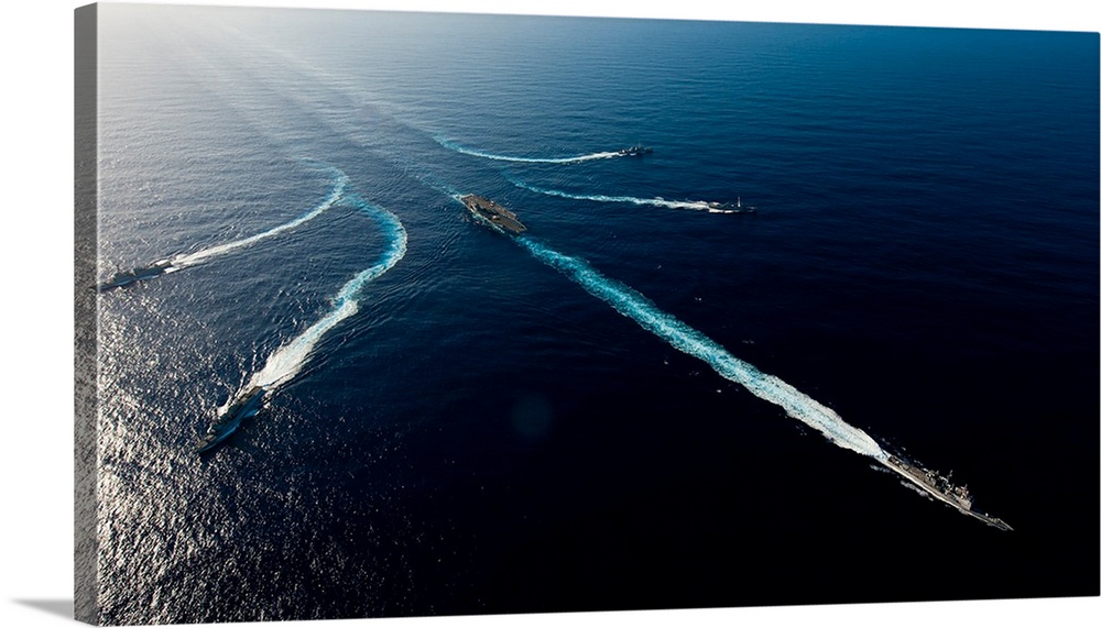 Ships from the John C. Stennis Carrier Strike Group transit the Pacific Ocean.