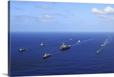 Ships from the Ronald Reagan Carrier Strike Group transit the Pacific Ocean
