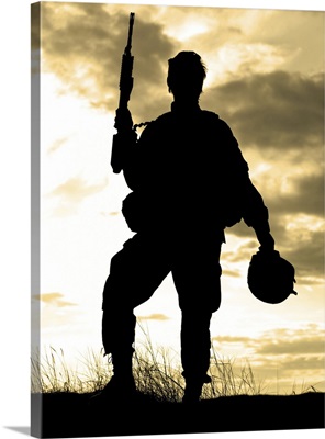 Silhouette Of U.S. Soldier With Rifle Against A Sunset