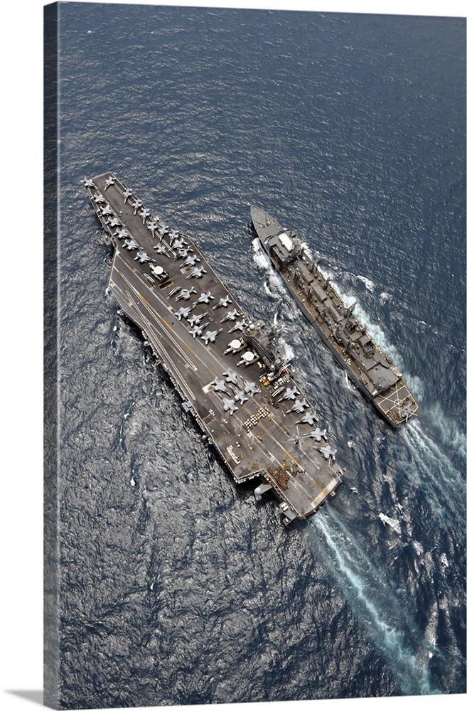 Aerial view of aircraft carrier USS Ronald Reagan and USNS Bridge during a replenishment at sea.