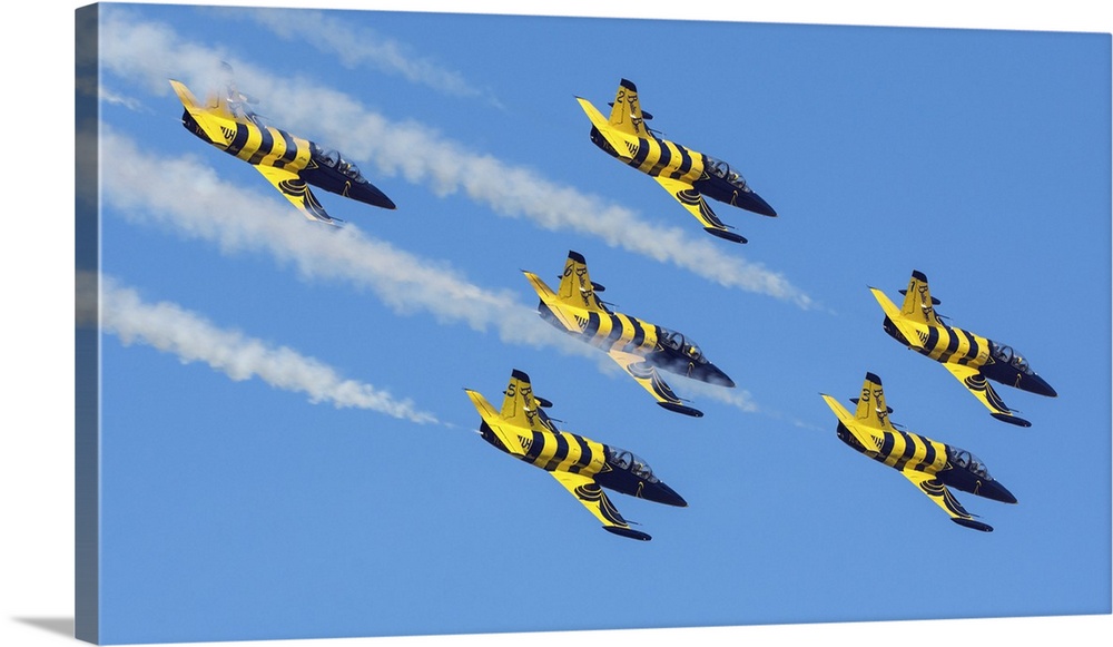 Six L-39C's of the Baltic Bees aerobatic team performing at an airshow in Iran.