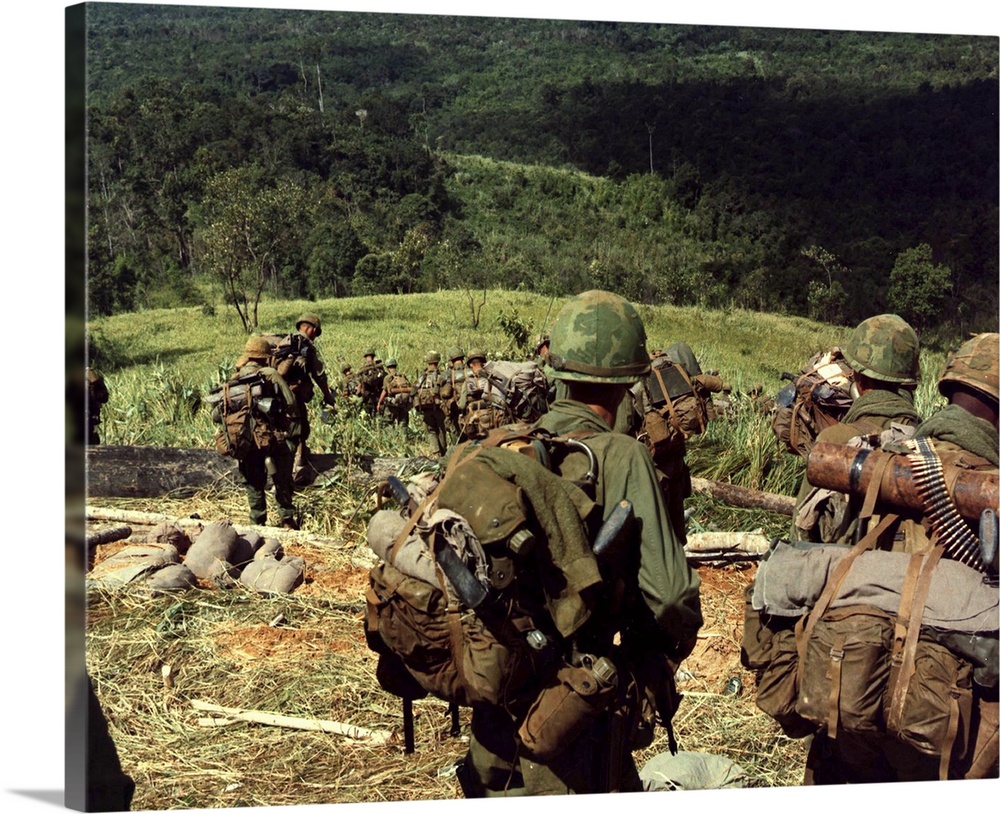 Soldiers descend the side of Hill 742, five miles northwest of Dak To, Vietnam, 1967.