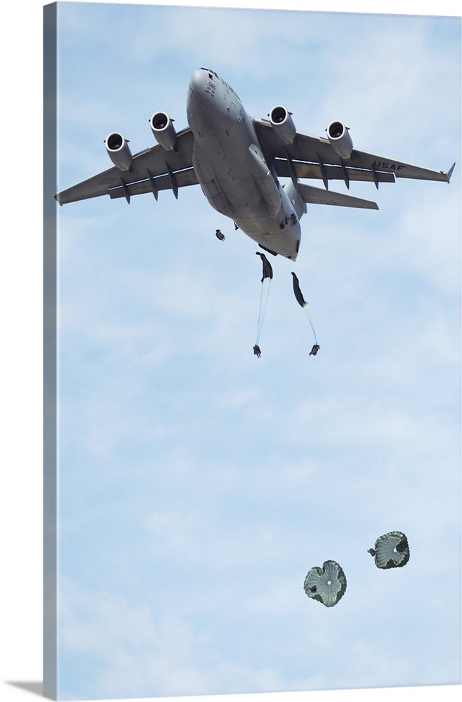 Soldiers jump from a C-17 Globemaster III during a Mobility Air Forces Exercise.
