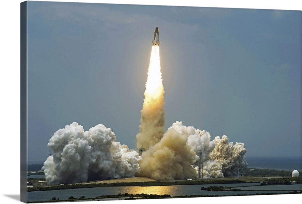 Space Shuttle Atlantis lifts off into the sky