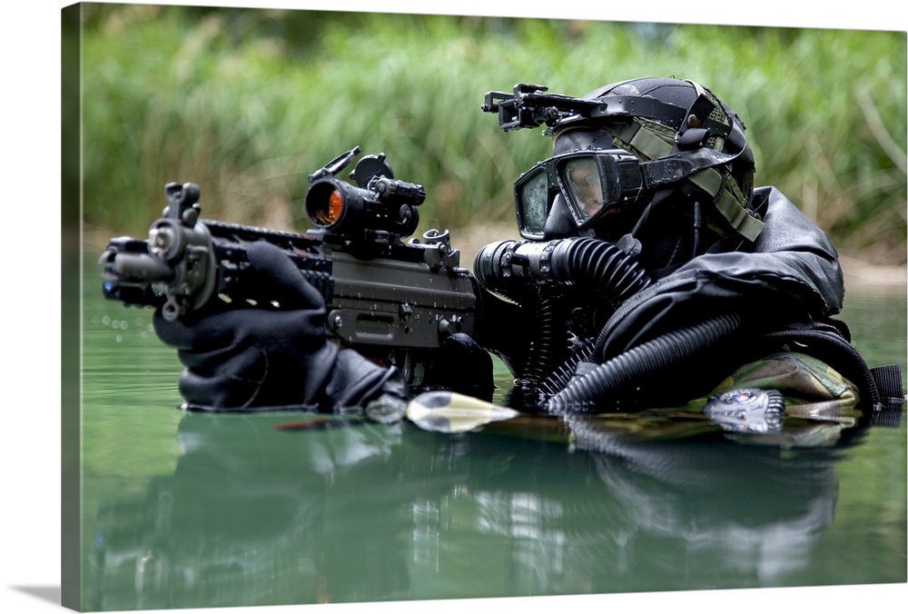 Wall art of a Special Forces diver standing with his shoulders out of the water holding a weapon.