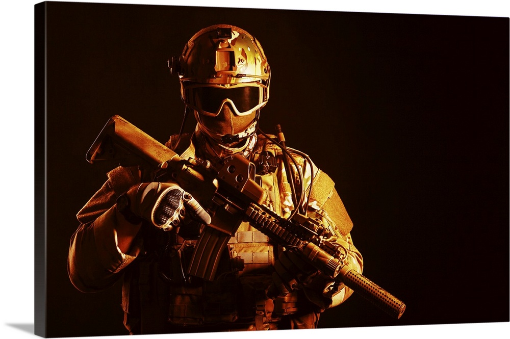 Special forces soldier with rifle on dark background.