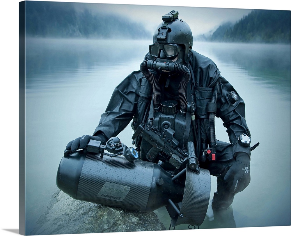 Special operations forces combat diver with underwater propulsion vehicle.