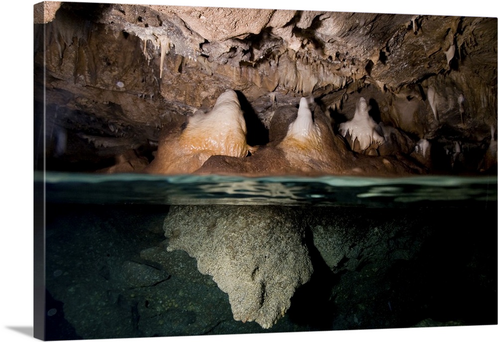 Split shot of stalactites and stalagmites in a cave, Australia.
