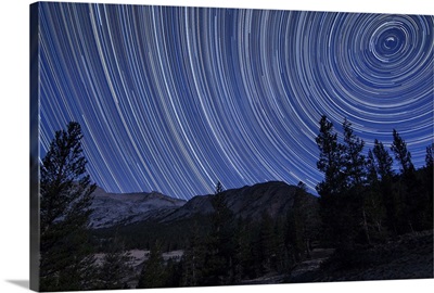 Star trails above mountain peaks near Yosemite National Park, California