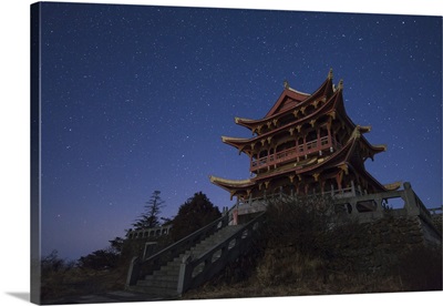 Stars shine above a temple of Mount Emei in China