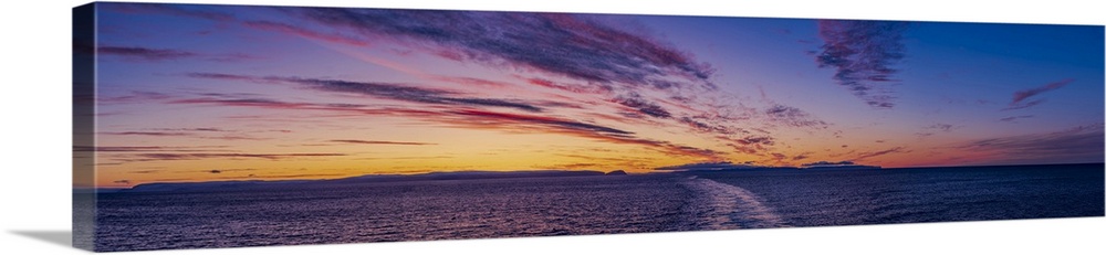 A sunset panorama from at sea on the Barents Sea in Northern Norway, from aboard the MS Trollfjord. -