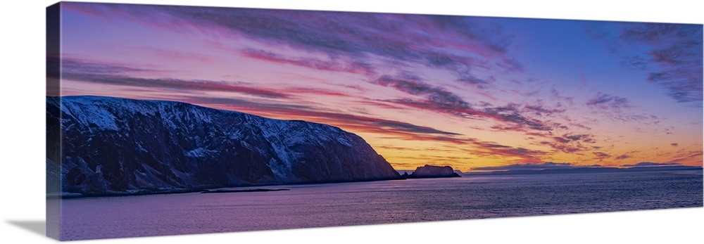 Sunset at the north end of Norway as we sailed past the sea cliffs of Finnkirka out of Honnigvag and North Cape.