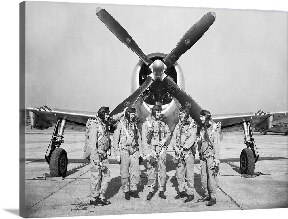 Test pilots stand in front of a P-47 Thunderbolt.