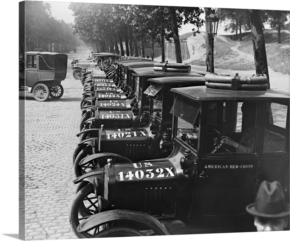 The American Red Cross transportation fleet lined up for inspection, Paris France, 1918.