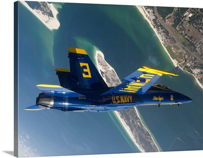 The Blue Angels perform a looping maneuver over Naval Air Station Pensacola