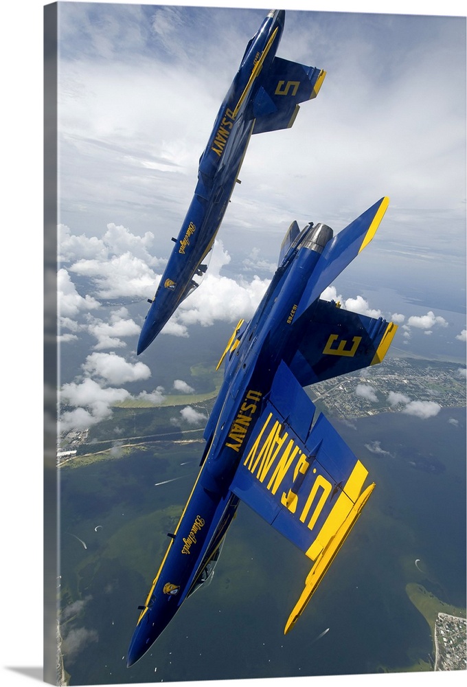 Pensacola, Florida, July 12, 2012 - The U.S. Navy flight demonstration squadron, the Blue Angels, perform a looping maneuv...